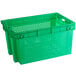 A green plastic agricultural crate with vents.