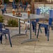 A rectangular gray powder-coated aluminum outdoor dining table with an umbrella hole.