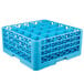 A blue plastic Carlisle glass rack with holes.