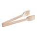 A pair of Carlisle beige plastic salad tongs.