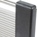 A close up of a metal rectangular object with a black handle.