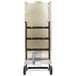 A silver metal cart with wheels and a handle holding a TPI FSP Series Infrared Flat Panel Heater.