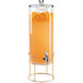 A Cal-Mil round beverage dispenser with an infusion chamber and orange juice with orange slices inside.