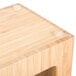 A wooden box with three circular openings.