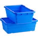 A stack of blue Choice meat lug tote boxes.