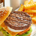 An AngusPure New Zealand Grass Fed Angus beef burger with a bun and fries.