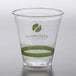 a clear plastic cup with a green logo