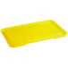 A yellow plastic tray with a recessed lid.