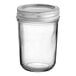 A clear glass Choice half-pint canning jar with a silver lid.