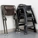 A brown Koala Kare infant seat on a folding chair.