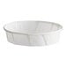 A white paper 1 oz. squat souffle or portion cup.