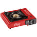 A red Choice portable stove with a black brass burner.