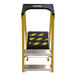 A yellow and black Bauer Corporation fiberglass step ladder with a steel platform.