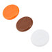A white circle with three different colored plastic buttons inside.