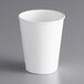 A Dart ThermoGuard white paper hot cup on a gray surface.