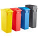 A group of Lavex recycle bins with black, yellow, and red lids.