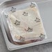 A plastic tray with Maple Leaf Farms boneless duck breasts in it.