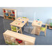 A classroom with Whitney Brothers clear acrylic tabletop partitions on wooden tables.