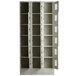 A white Winholt triple column metal locker with open perforated doors.