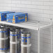 A Regency Top Shelf for Keg Racks holding beer bottles and cans.