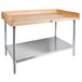 A John Boos wood top baker's table with a stainless steel base and adjustable undershelf.