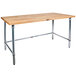 A John Boos wood top work table with a galvanized metal base.