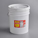 A white bucket with a red and yellow label on the lid.