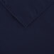 A navy blue rectangular cloth table cover with a hemmed edge.