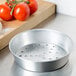 An American Metalcraft silver aluminum pizza pan with holes in it.