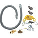 A Dormont gas hose kit with fittings, elbows, and a yellow restraining cable.