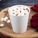 A Dart double wall insulated white paper hot cup filled with hot chocolate and marshmallows.