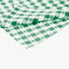 A green and white checkered Intedge vinyl table cover.