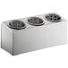 A stainless steel flatware organizer with three perforated stainless steel cylinders.