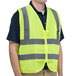 A man wearing a Cordova lime yellow high visibility safety vest.