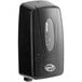 A black soap dispenser with a clear window.