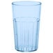 A clear plastic tumbler with a blue rim.