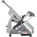 A close-up of a Hobart meat slicer with a metal blade.