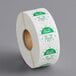 a roll of labels with green text