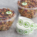 A roll of Point Plus green "Sugar Free" labels on a counter with plastic containers of granola.