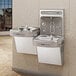 An Elkay stainless steel dual hands-free bottle filling station and drinking fountain.