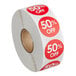 A roll of Point Plus 50% off red and white labels.