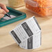 A roll of removable day of the week labels marked for Sunday, used for food storage and organization.