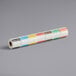 A roll of white paper with colorful Noble Products food labeling stickers.