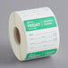 a roll of paper with green and white labels