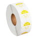 A roll of yellow and white permanent day of the week clock labels marked for Tuesday.