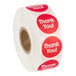 A roll of red circular labels with 'Thank You!' printed in white text.