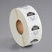 A roll of white paper with black and white text that reads "Sunday" and "1 inch" on each label.