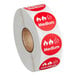 A roll of red and white Point Plus Medium stickers with the words "Medium" on them.