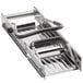 A metal mandoline with black handles on a counter.