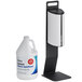 A white Lavex metal table top hand sanitizer dispenser stand with a blue and white hand sanitizer jug.